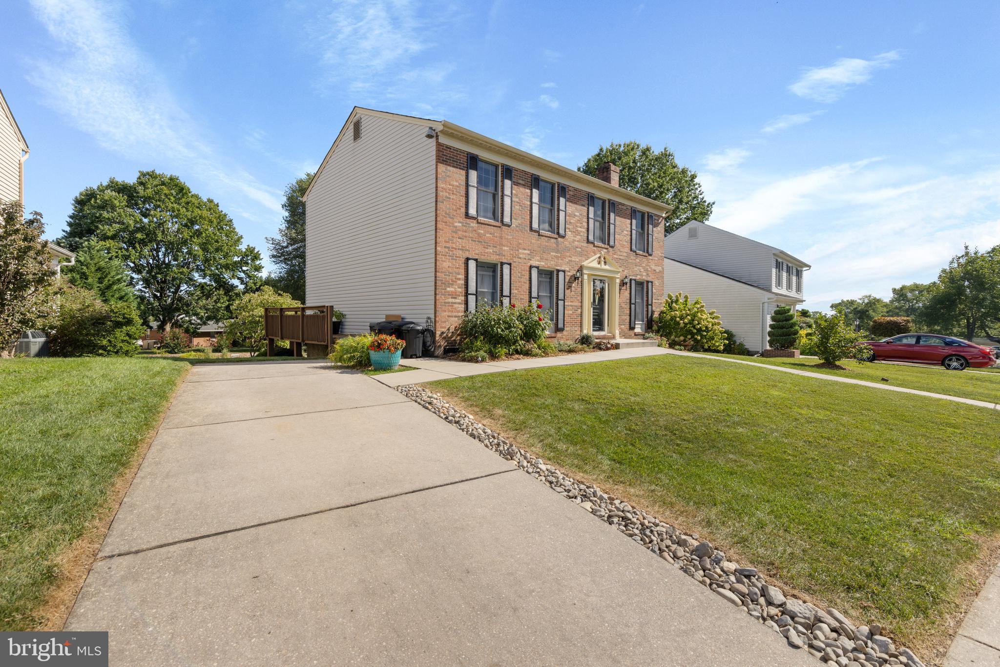 9209 Ramblebrook Road Baltimore, MD 21236 - Photo 3 of 54 a front view of a house with a yard