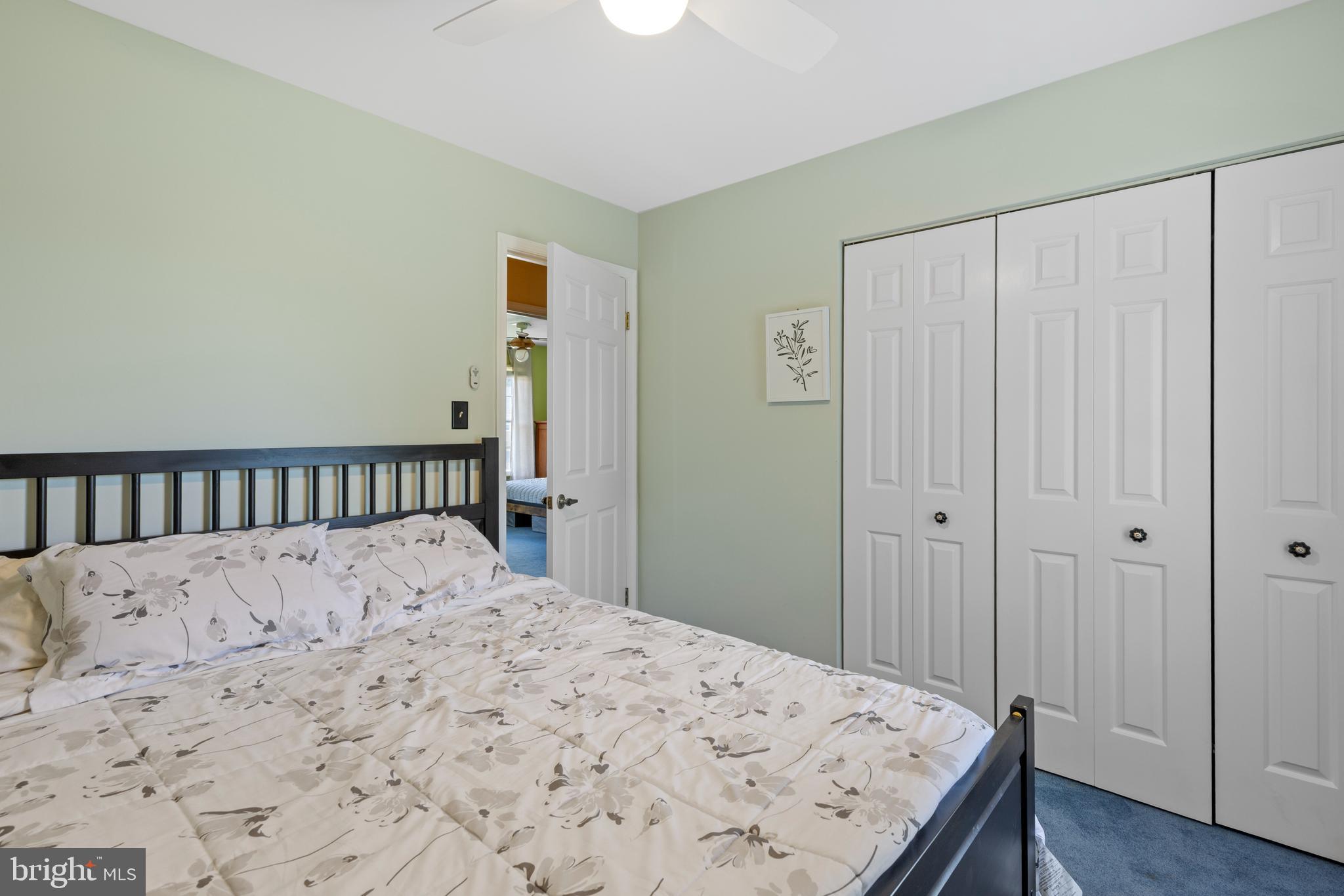 9209 Ramblebrook Road Baltimore, MD 21236 - Photo 32 of 54 a large bed sitting in a bedroom next to a bathroom
