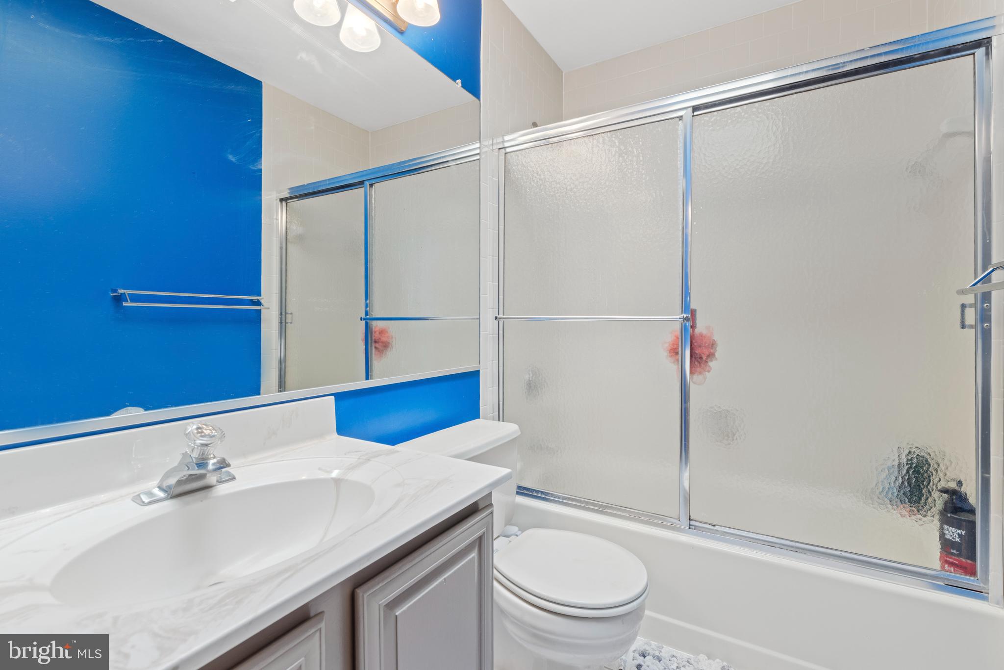 9209 Ramblebrook Road Baltimore, MD 21236 - Photo 35 of 54 a bathroom with a sink toilet and shower