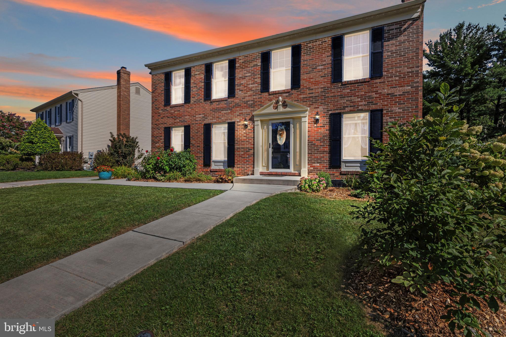 9209 Ramblebrook Road Baltimore, MD 21236 - Photo 4 of 54 a front view of a building with garden