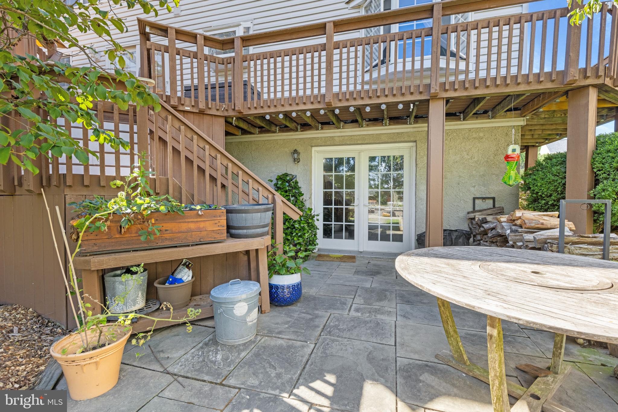 9209 Ramblebrook Road Baltimore, MD 21236 - Photo 47 of 54 a view of a patio with table and chairs potted plants