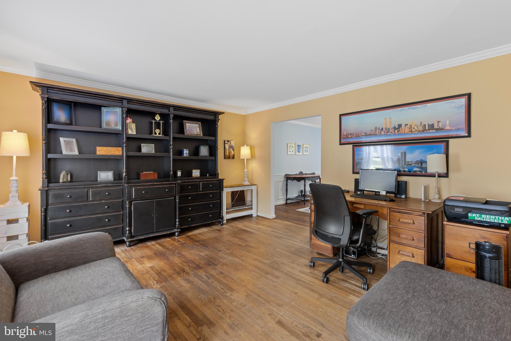9209 Ramblebrook Road Baltimore, MD 21236 - Photo 5 of 54 a view of a workspace with furniture and wooden floor