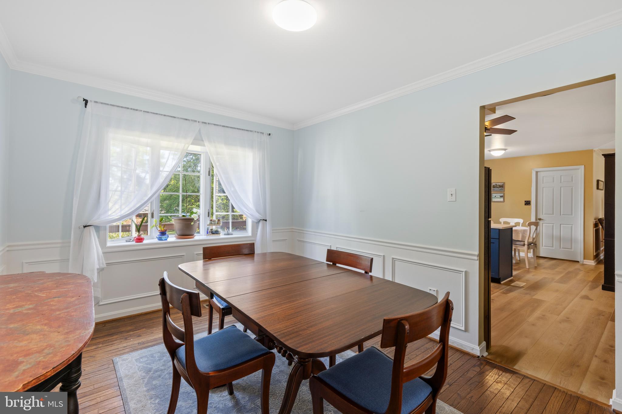 9209 Ramblebrook Road Baltimore, MD 21236 - Photo 8 of 54 a view of a dining room with furniture and a window