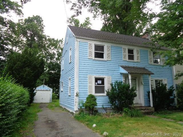 470 Cornwall Street Hartford, CT 06112 - Photo 1 of 1 a front view of a house with a yard and garage
