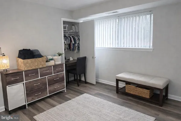 a bedroom with a workspace