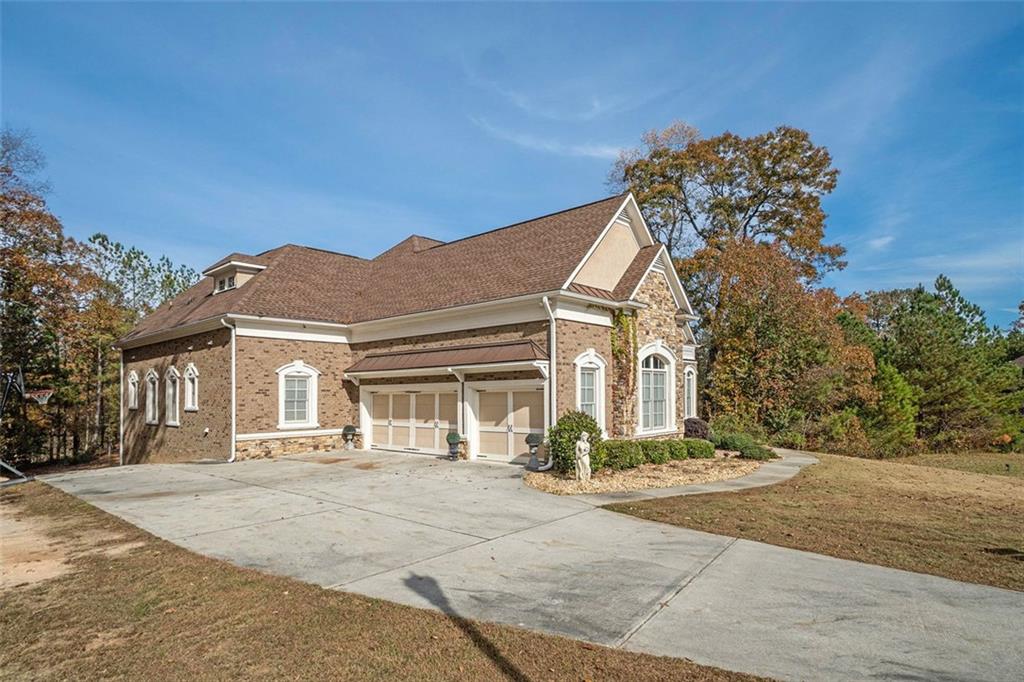 1059 Concerto Court Fairburn, GA 30213 - Photo 4 of 14 a view of a white house with a outdoor space