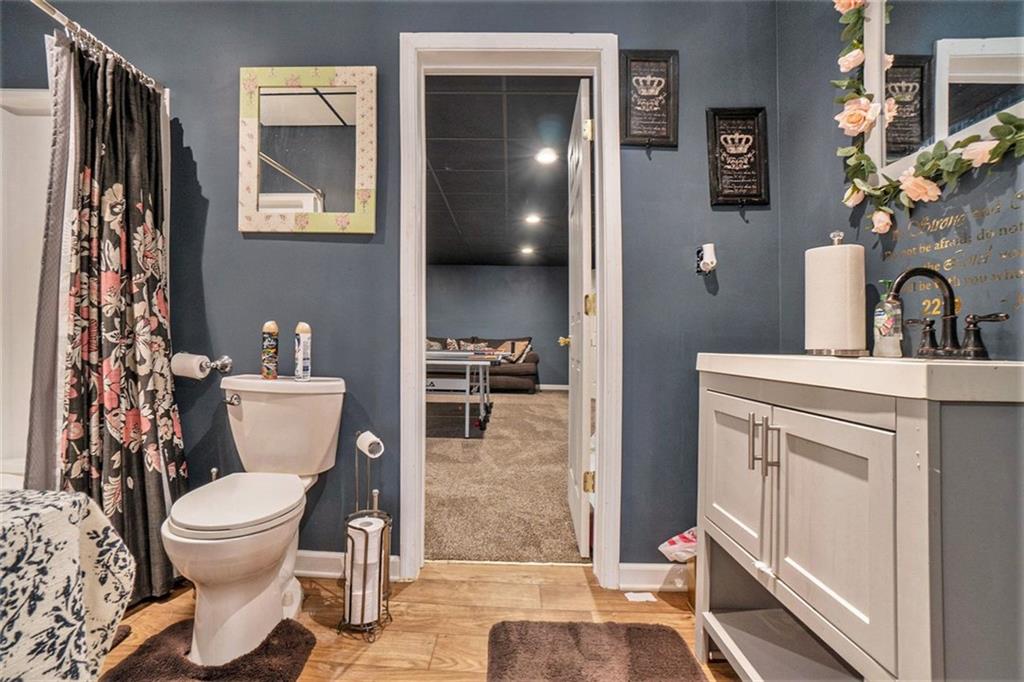 1059 Concerto Court Fairburn, GA 30213 - Photo 8 of 14 a bathroom with a toilet sink and mirror