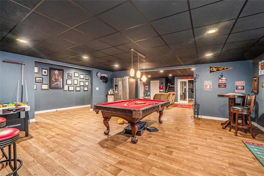 1059 Concerto Court Fairburn, GA 30213 - Photo 9 of 14 a dining room with furniture a rug and wooden floor