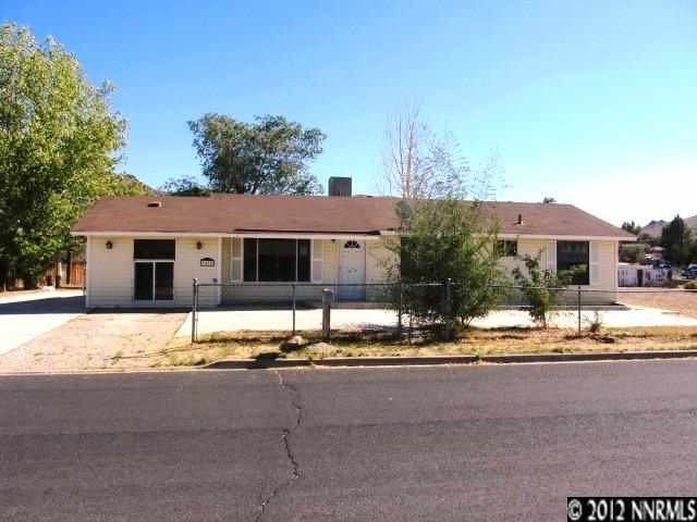 9450 Fremont Way Reno, NV 89506 - Photo 1 of 1 a house with palm tree in front of it