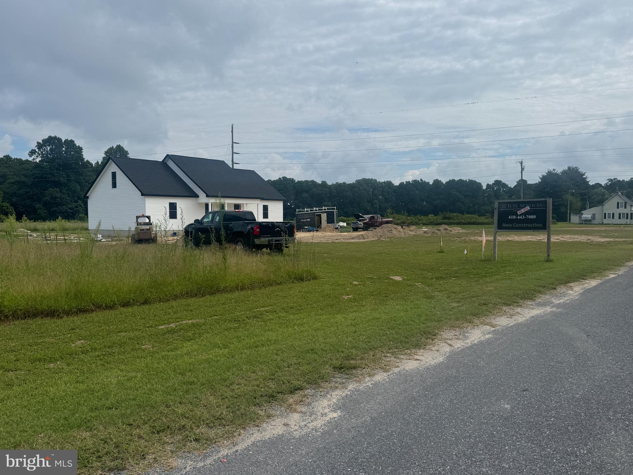4715 Petersburg Back Street Hurlock, MD 21643 - Photo 9 of 16 a front view of a house with a yard and lake view