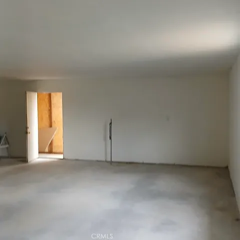 a view of a room that has a window in it