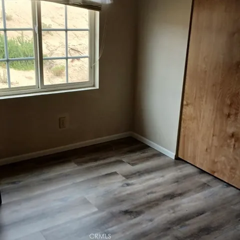 a aerial view of a house with a yard and potted plants