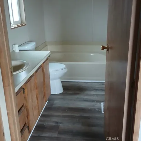 a view of a bathroom from a hallway