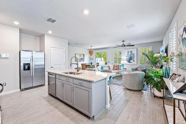 a kitchen with a sink and refrigerator