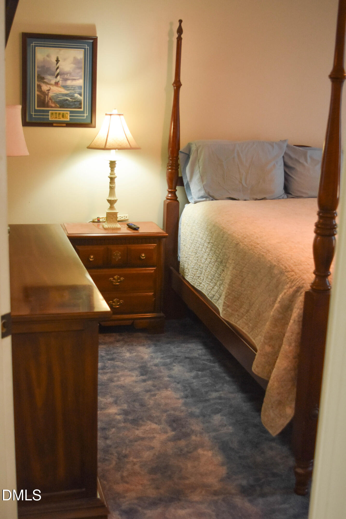 5908 Deep Spring Circle Wake Forest, NC 27587 - Photo 36 of 51 a bedroom with a bed and a lamp on the dresser
