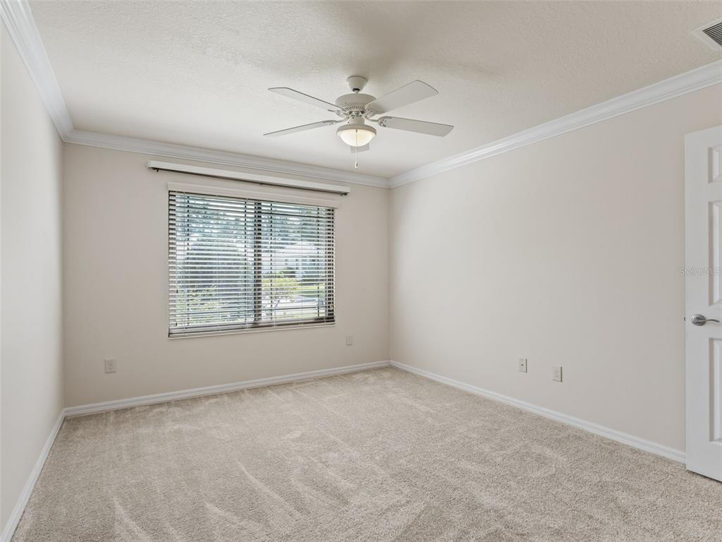 2360 Hopespring Loop The Villages, FL 32162 - Photo 20 of 30 an empty room with a window and a fan