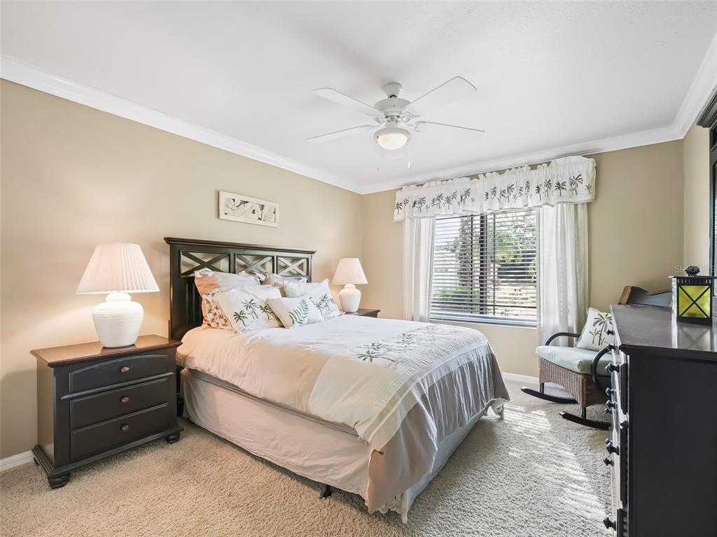 2360 Hopespring Loop The Villages, FL 32162 - Photo 21 of 30 a bedroom with a bed and wooden floor
