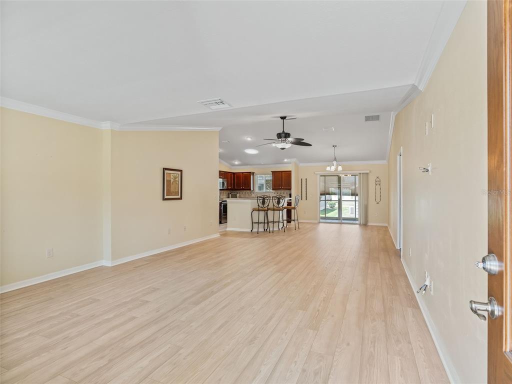 2360 Hopespring Loop The Villages, FL 32162 - Photo 5 of 30 a view of a livingroom with furniture and wooden floor