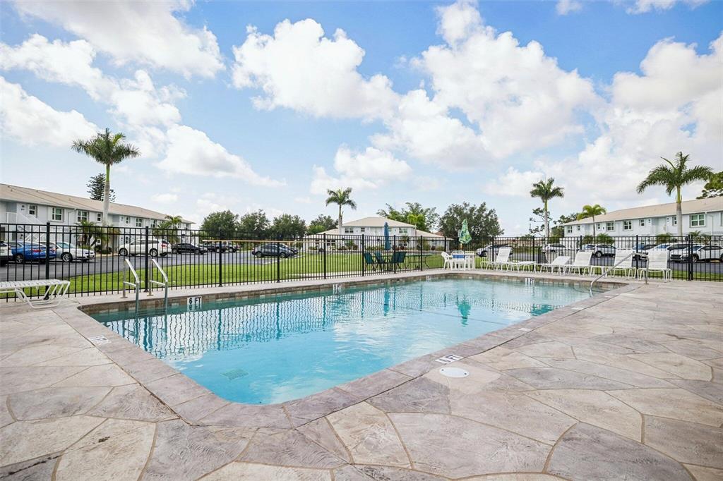 26485 Rampart Boulevard, Unit A27 Punta Gorda, FL 33983 - Photo 5 of 27 a view of swimming pool with outdoor seating and plants