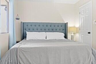 7625 East Camelback Road, Unit B228 Scottsdale, AZ 85251 - Photo 11 of 24 a large white bed in a white bedroom