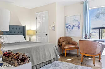 7625 East Camelback Road, Unit B228 Scottsdale, AZ 85251 - Photo 12 of 24 a bedroom with a bed and a window
