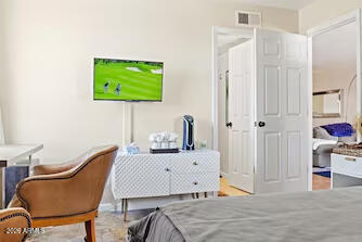7625 East Camelback Road, Unit B228 Scottsdale, AZ 85251 - Photo 13 of 24 a room that has a bed and a chair in it