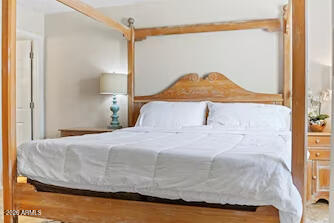 7625 East Camelback Road, Unit B228 Scottsdale, AZ 85251 - Photo 14 of 24 a bedroom with a bed and window