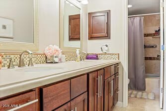7625 East Camelback Road, Unit B228 Scottsdale, AZ 85251 - Photo 17 of 24 a bathroom with a sink and mirror