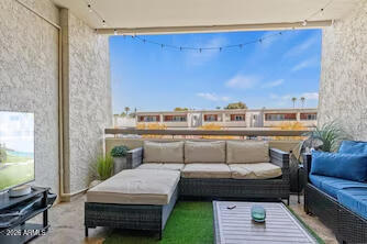 7625 East Camelback Road, Unit B228 Scottsdale, AZ 85251 - Photo 21 of 24 a living room with furniture and a rug