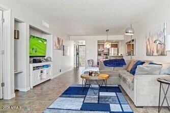 7625 East Camelback Road, Unit B228 Scottsdale, AZ 85251 - Photo 4 of 24 a living room with furniture and a wooden floor