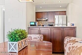 7625 East Camelback Road, Unit B228 Scottsdale, AZ 85251 - Photo 8 of 24 a kitchen with sink cabinets and window