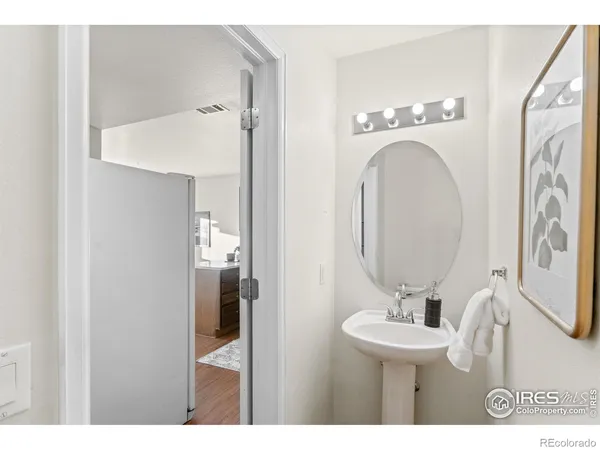 a bathroom with a sink a mirror and a toilet