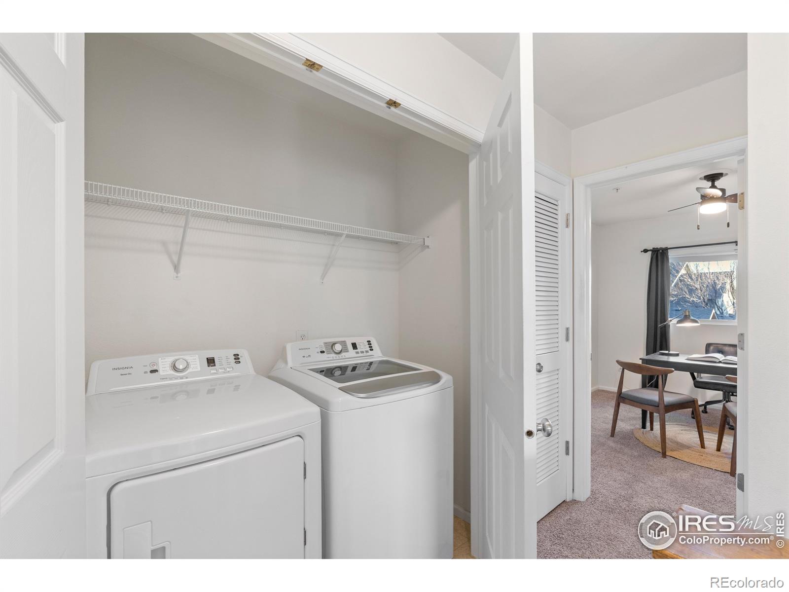 2900 Purcell Street, Unit O4 Brighton, CO 80601 - Photo 24 of 28 a utility room with dryer washer and a view of living area
