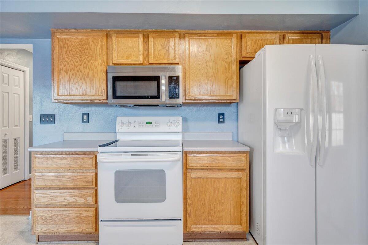 6717 Albert Road Roanoke, VA 24019 - Photo 12 of 48 a kitchen with a stove and a white refrigerator