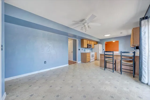 a view of storage and utility room with a hallway