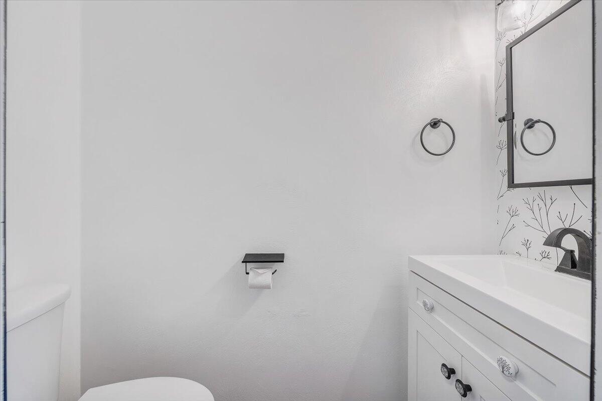 6717 Albert Road Roanoke, VA 24019 - Photo 21 of 48 a bathroom with a sink mirror vanity and toilet