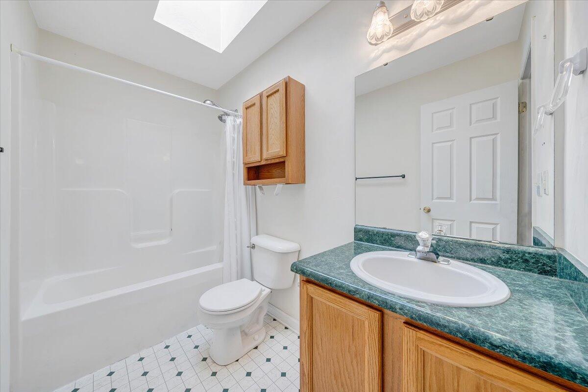6717 Albert Road Roanoke, VA 24019 - Photo 27 of 48 a bathroom with a granite countertop sink toilet and shower