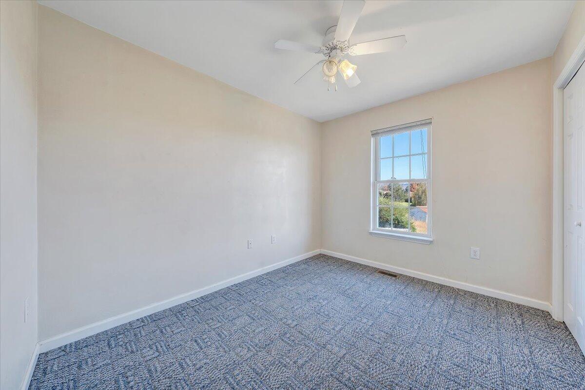 6717 Albert Road Roanoke, VA 24019 - Photo 30 of 48 an empty room with windows and fan
