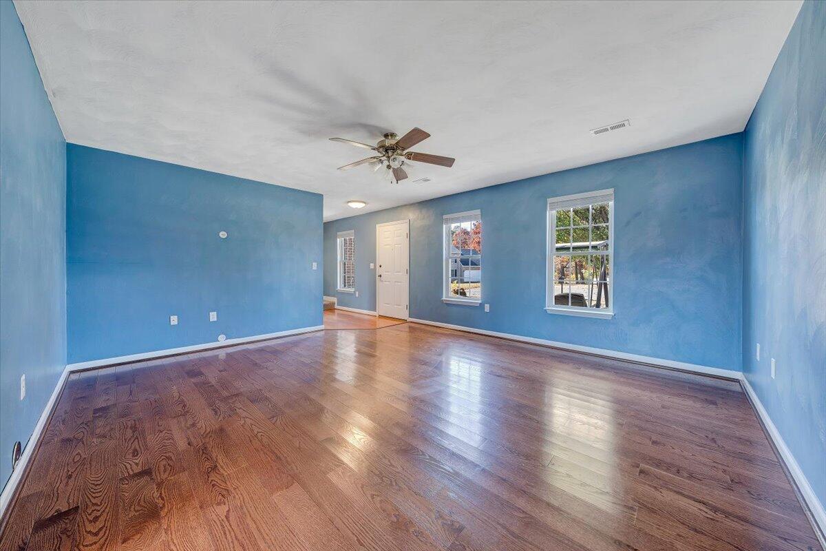 6717 Albert Road Roanoke, VA 24019 - Photo 3 of 48 a view of an empty room with window and wooden floor