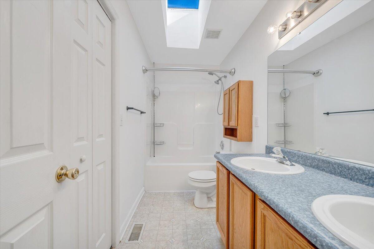 6717 Albert Road Roanoke, VA 24019 - Photo 37 of 48 a bathroom with a granite countertop sink toilet and shower