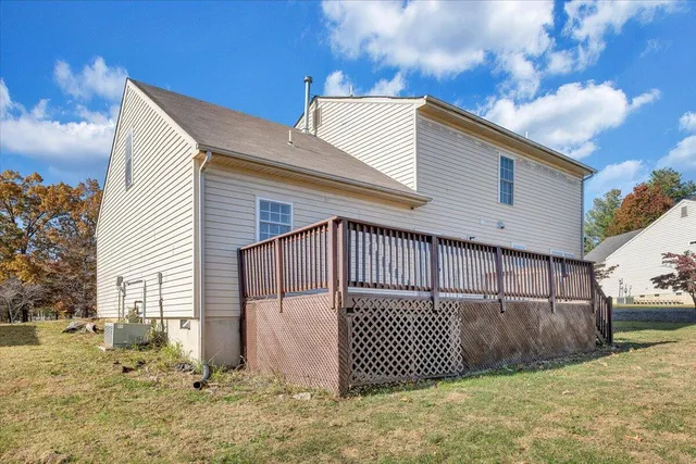a view of a house with wooden fence