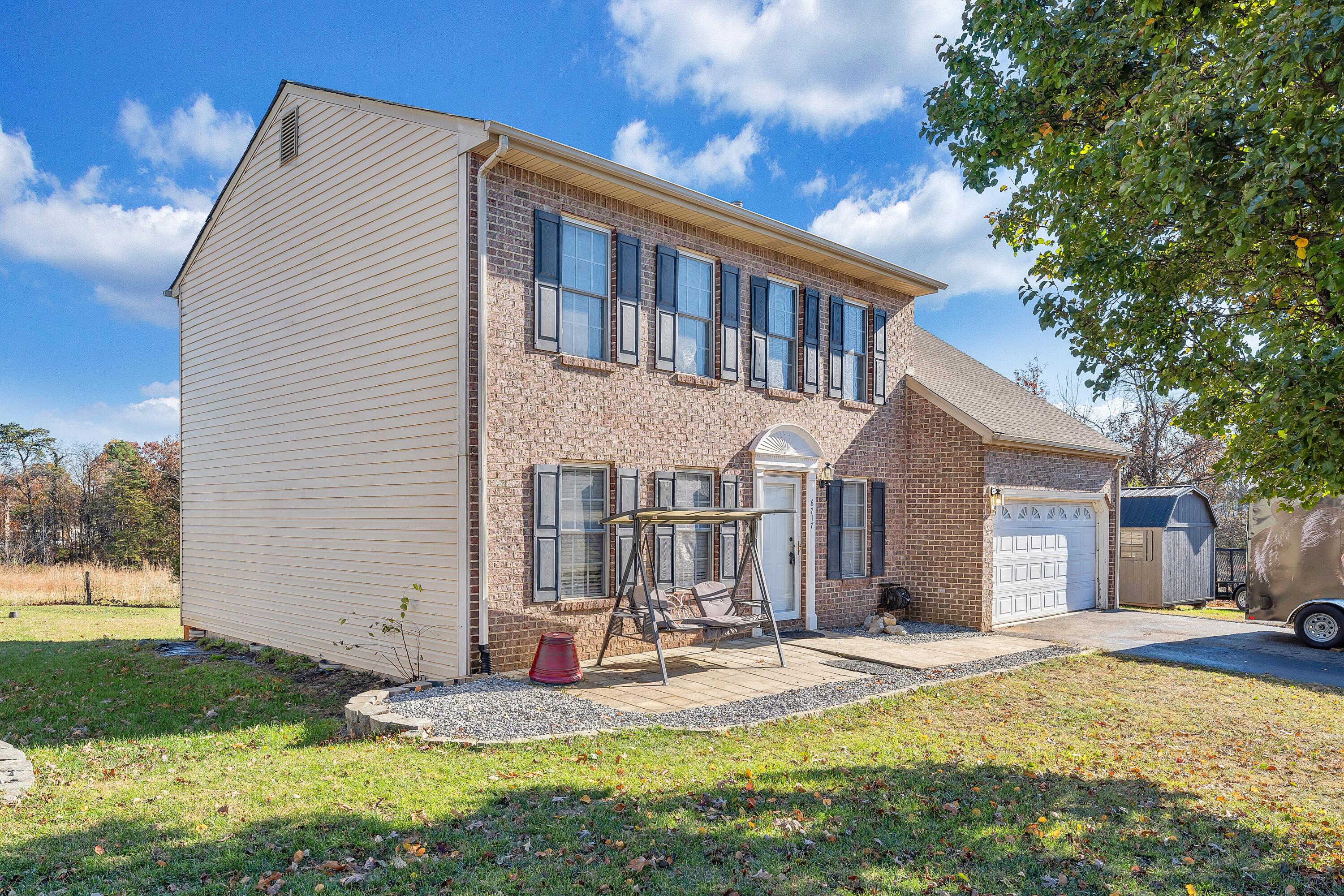 6717 Albert Road Roanoke, VA 24019 - Photo 45 of 48 a backyard of a house with yard and outdoor seating
