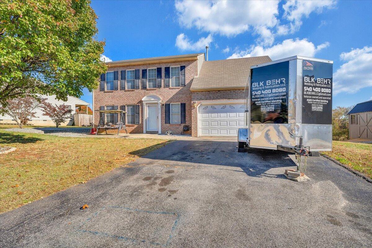 6717 Albert Road Roanoke, VA 24019 - Photo 48 of 48 a view of a building with a yard