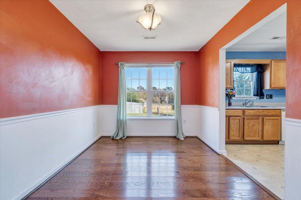 6717 Albert Road Roanoke, VA 24019 - Photo 7 of 48 a view of an empty room with window and wooden floor