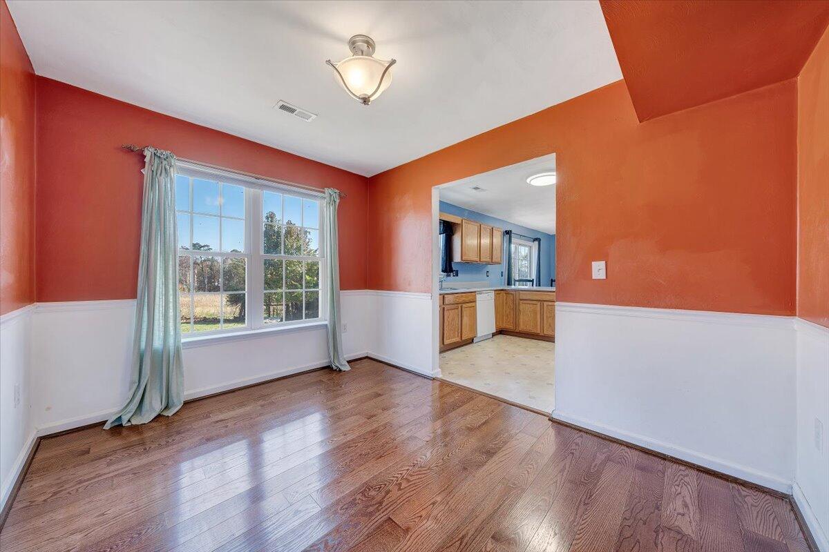 6717 Albert Road Roanoke, VA 24019 - Photo 8 of 48 a view of an empty room with a window and wooden floor