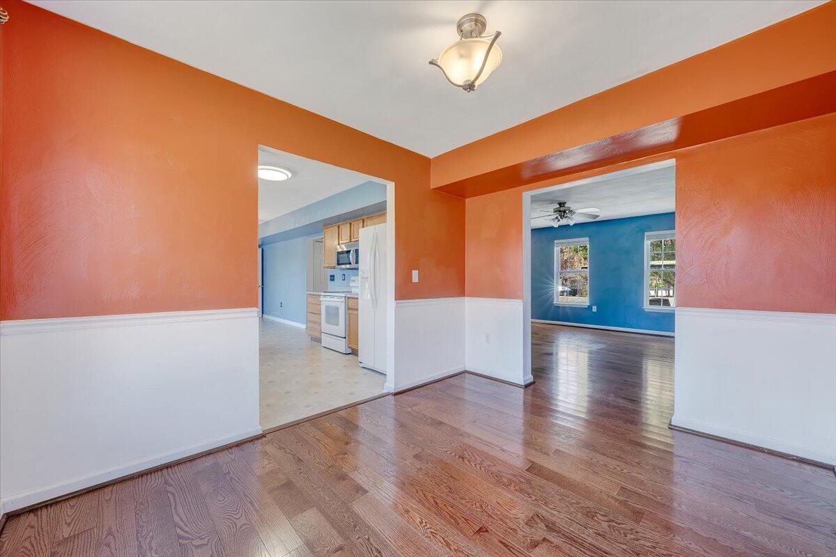 6717 Albert Road Roanoke, VA 24019 - Photo 9 of 48 wooden floor in an empty room with a window