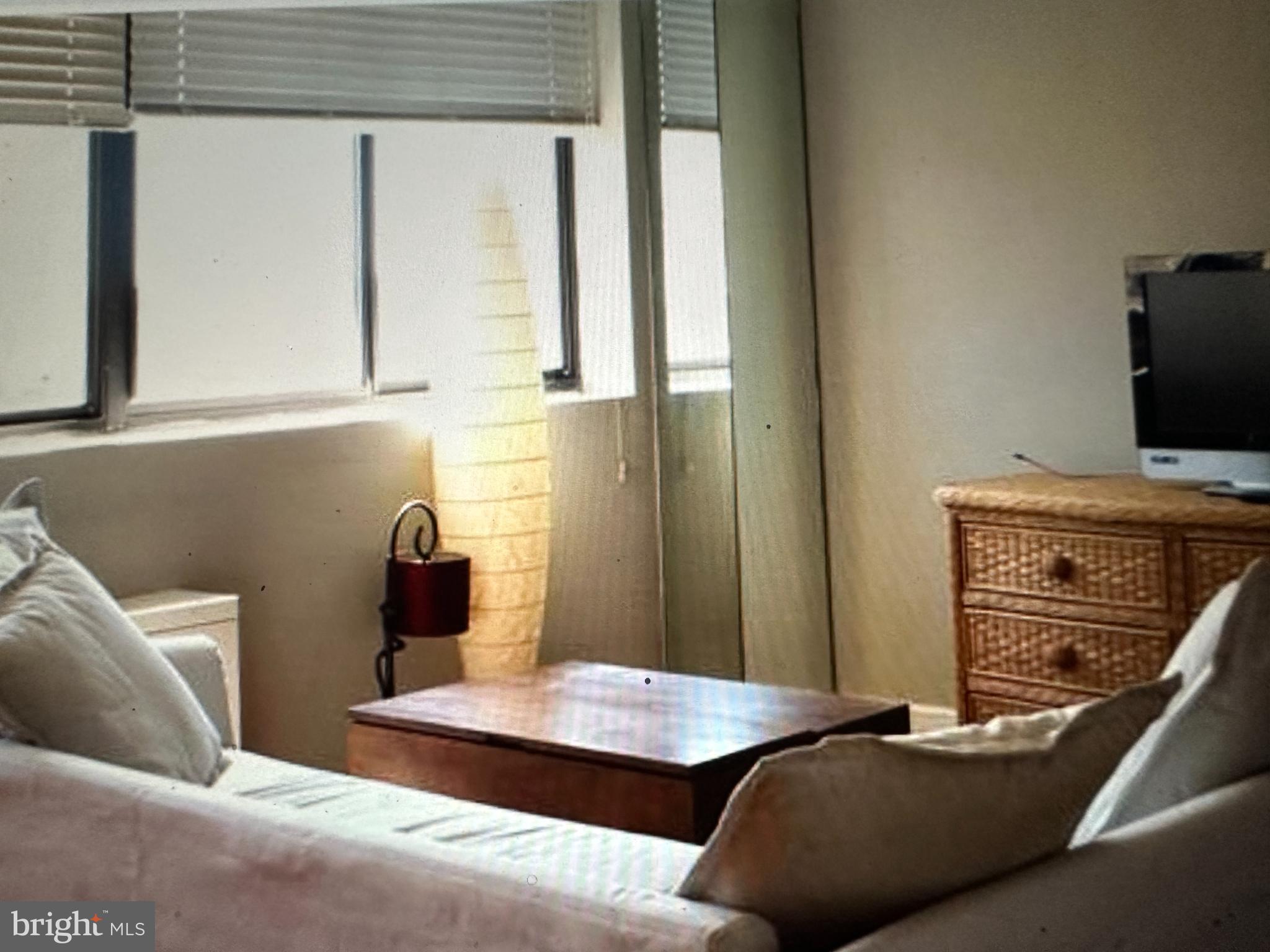 522 21st Street Northwest, Unit 1003 Washington, DC 20037 - Photo 4 of 15 a living room with furniture and a flat screen tv