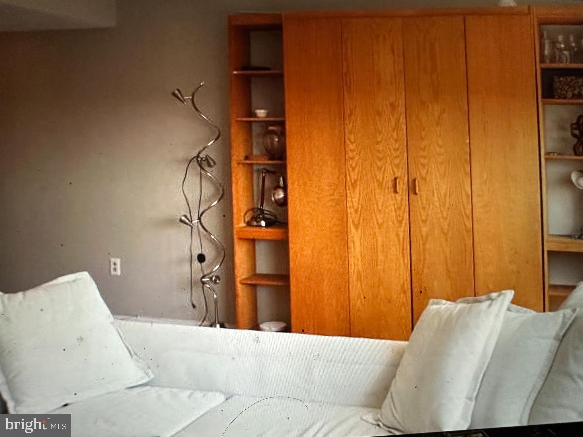 522 21st Street Northwest, Unit 1003 Washington, DC 20037 - Photo 5 of 15 a bedroom with a bed and a couch