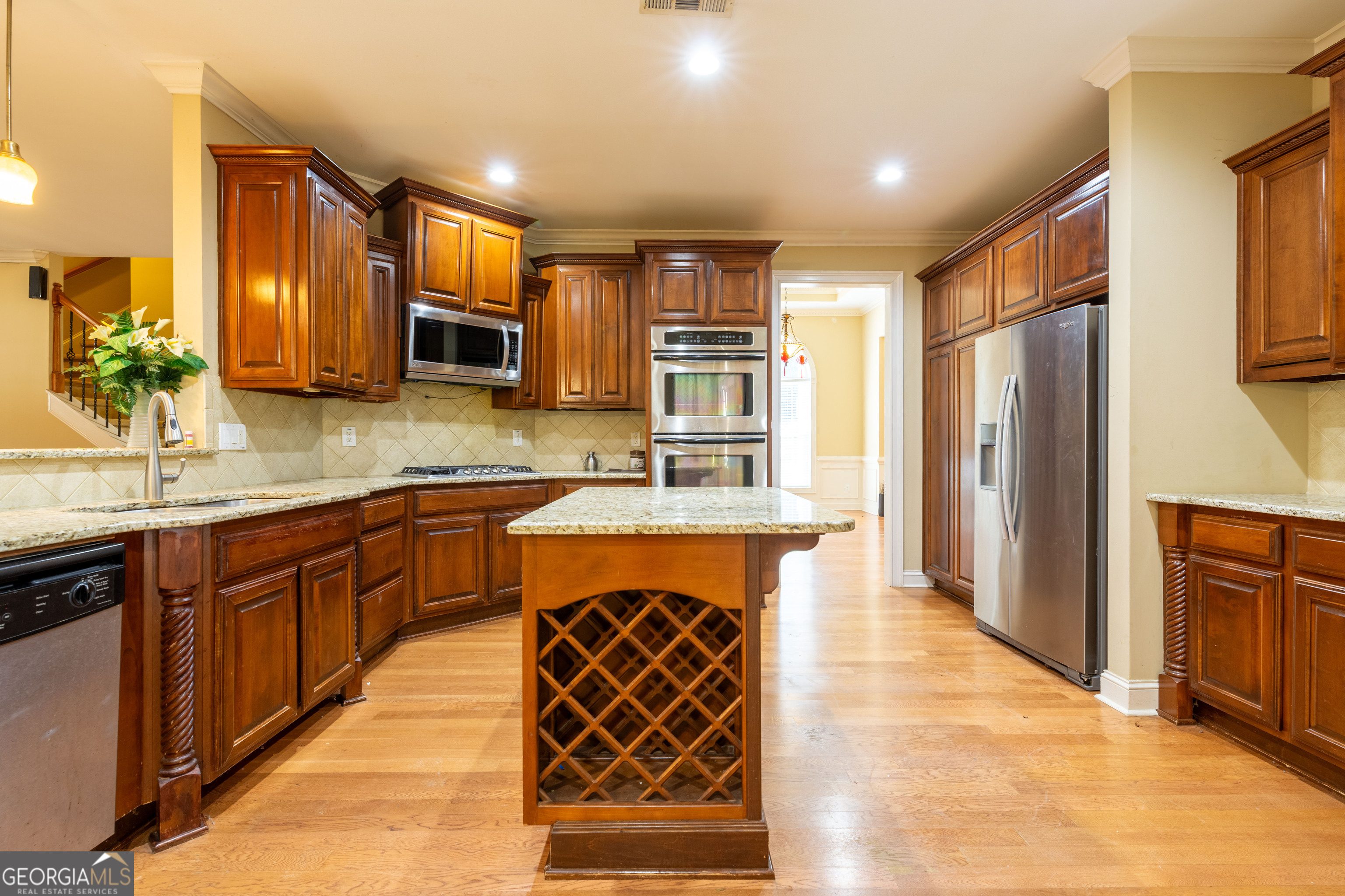 3194 Liverpool Street Jonesboro, GA 30236 - Photo 12 of 44 a large kitchen with stainless steel appliances granite countertop a sink stove and refrigerator