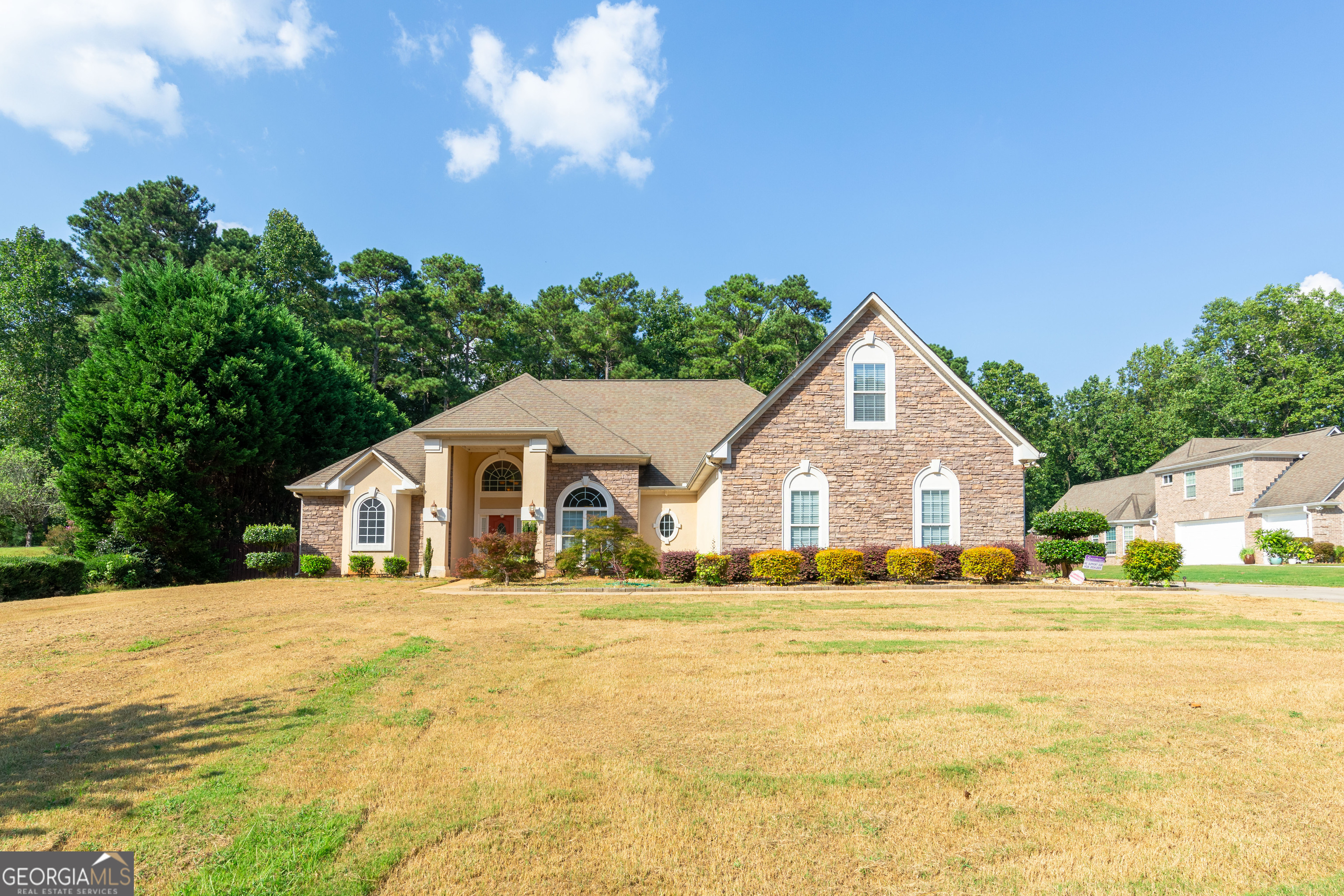 3194 Liverpool Street Jonesboro, GA 30236 - Photo 2 of 44 a view of a house with a yard